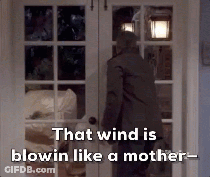 Man Standing Before Wind Is Blowing Door GIF