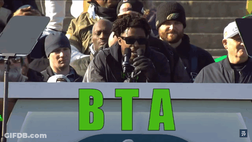 Man Standing Behind BTA Podium GIF