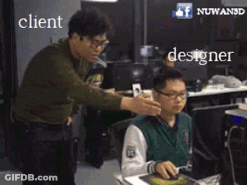 Man Standing Beside Sitting Man At Computer With Client And Designer GIF