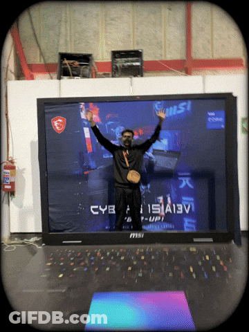 Man Standing By Large MSI Laptop GIF