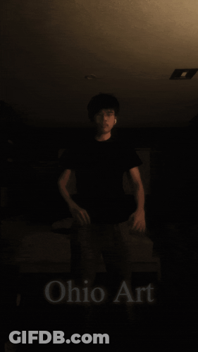 Man Standing By Large Yellow Ball GIF