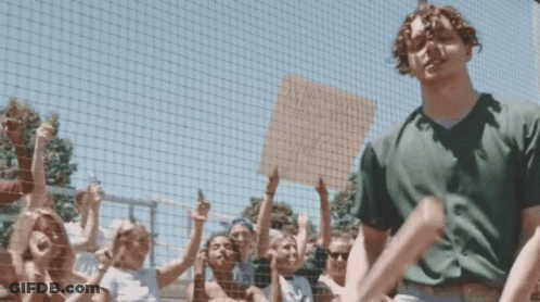 Man Standing By Sign: Twitter User @Tylerherrowld Is Here GIF