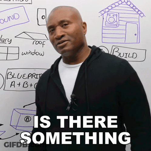 Man Standing By White Board Saying Is There Something GIF