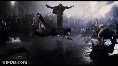Man Standing In Crowd Of Zombies GIF