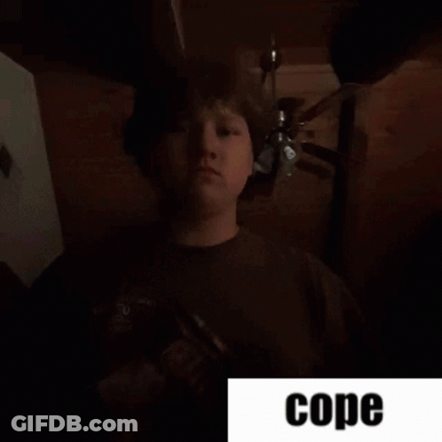 Man Standing In Dark Room Saying Cope GIF