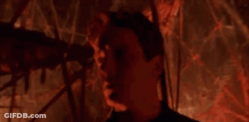 Man Standing In Dark Room Saying Welcome GIF