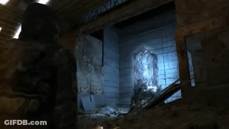Man Standing In Dark Room With Apocalypse Sticker GIF
