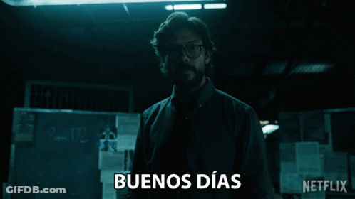 Man Standing In Dark Room With Buenos Dias On Bottom GIF