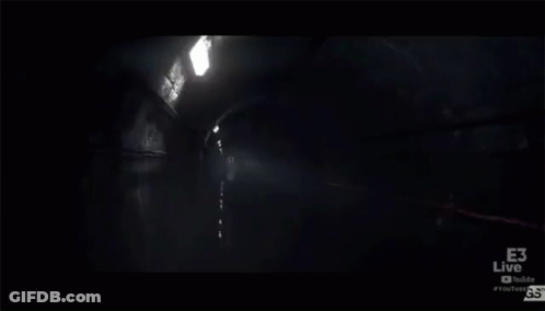 Man Standing In Dark Room With Microphone In Mouth GIF