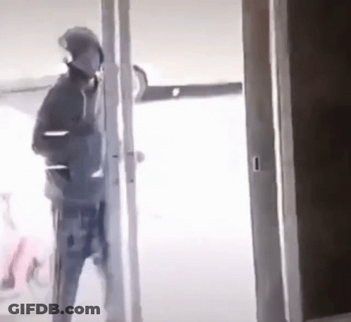 Man Standing In Doorway GIF