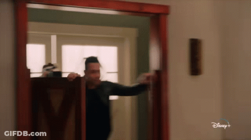 Man Standing In Doorway With Disney Plus GIF