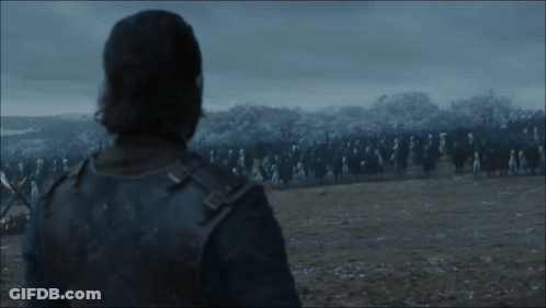 Man Standing In Field Looking At Large Army GIF