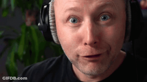 Man Standing In Field With Car And Rubbish On Face GIF