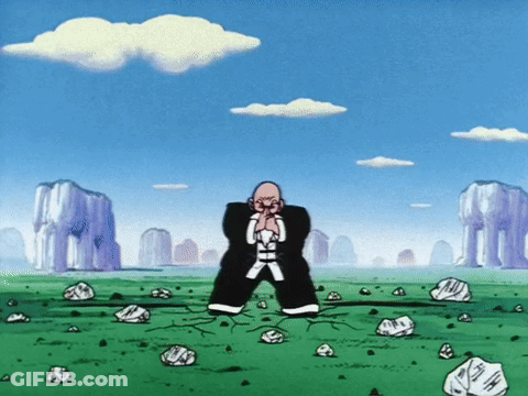 Man Standing In Field With Rocks And Mountains GIF