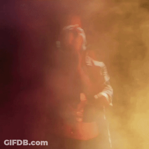 Man Standing In Foggy Room With Gun GIF