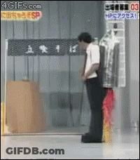 Man Standing In Front Of 4Gifs.com Sign GIF