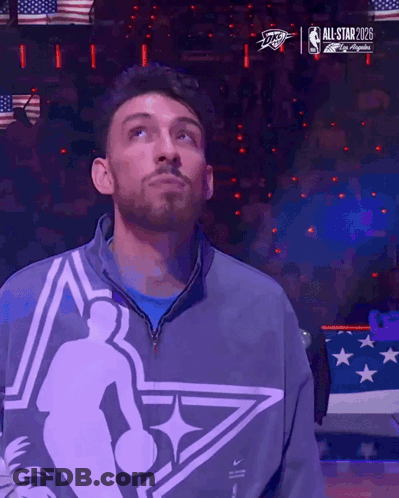 Man Standing In Front Of All Star 2028 Screen GIF