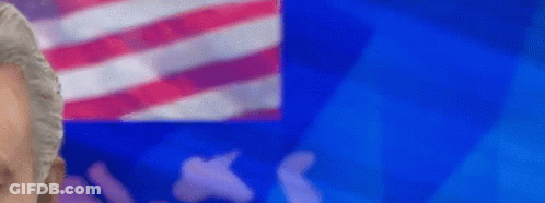 Man Standing In Front Of American Flag GIF