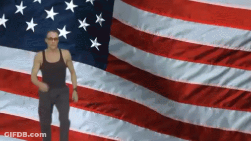 Man Standing In Front Of American Flag GIF