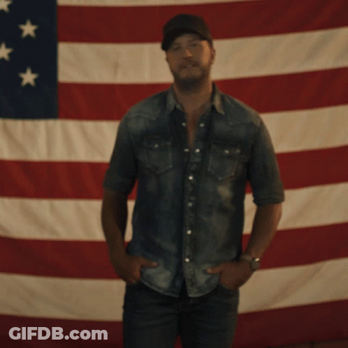 Man Standing In Front Of American Flag GIF