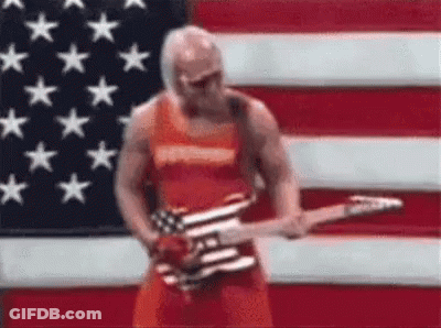 Man Standing In Front Of American Flag Playing Guitar GIF
