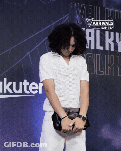 Man Standing In Front Of Arrivals Sign GIF