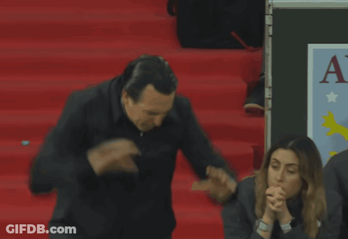 Man Standing In Front Of AV Sign GIF