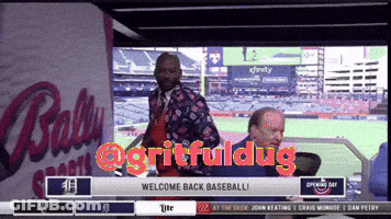 Man Standing In Front Of Ballpark Saying Welcome Back Baseball GIF