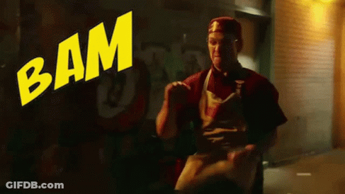 Man Standing In Front Of Bam Sign GIF