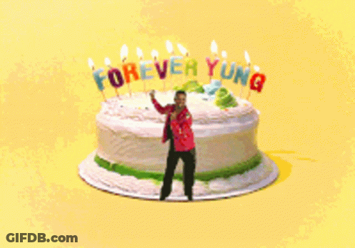 Man Standing In Front Of Birthday Cake Saying Forever Young GIF