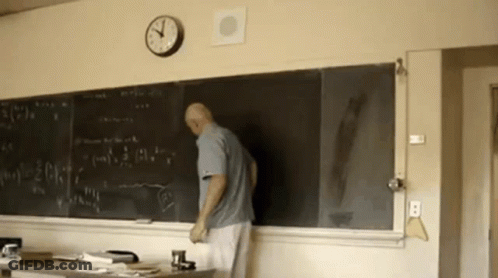 Man Standing In Front Of Blackboard GIF