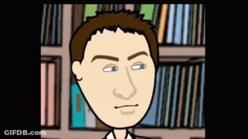 Man Standing In Front Of Bookshelves GIF