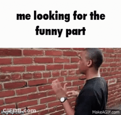 Man Standing In Front Of Brick Wall Looking For Funny Part GIF