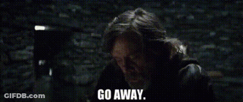 Man Standing In Front Of Brick Wall Saying Go Away GIF