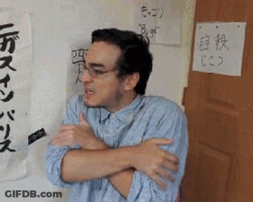 Man Standing In Front Of Bugs Sign GIF