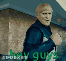 Man Standing In Front Of Building Saying Hey Guys GIF