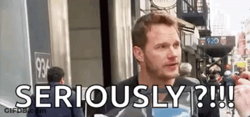 Man Standing In Front Of Building Saying Seriously GIF