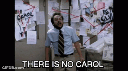 Man Standing In Front Of Bulletin Board Saying Carol GIF