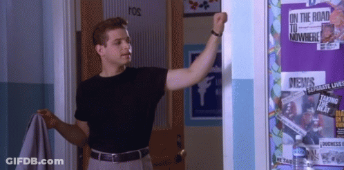 Man Standing In Front Of Bulletin Board Saying On The Road To Nowhere GIF