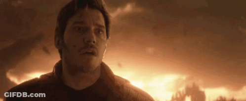 Man Standing In Front Of Burning Building GIF