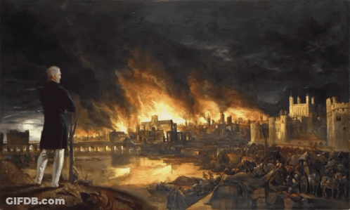 Man Standing In Front Of Burning City GIF