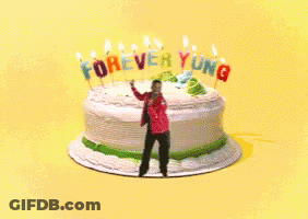 Man Standing In Front Of Cake Saying Forever Young GIF