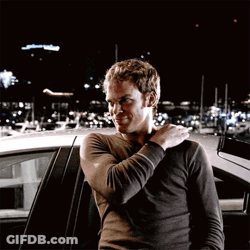 Man Standing In Front Of Car With Arm On Shoulder GIF