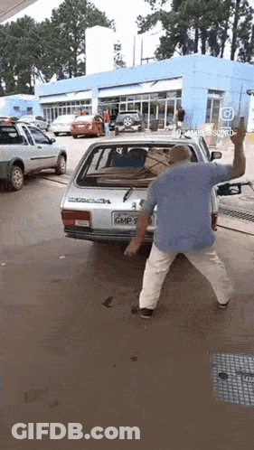 Man Standing In Front Of Car With License Plate GMP 7 GIF