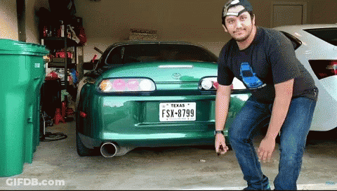 Man Standing In Front Of Car With Texas License Plate GIF