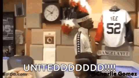 Man Standing In Front Of Clock And Jersey 52 GIF