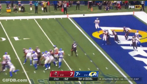 Man Standing In Front Of Clock And Jersey Number 52 GIF