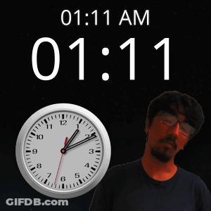 Man Standing In Front Of Clock Saying 1:11 GIF