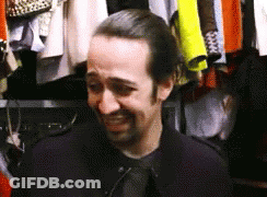Man Standing In Front Of Closet With Clothes GIF