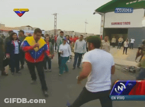 Man Standing In Front Of Cojedes Building GIF